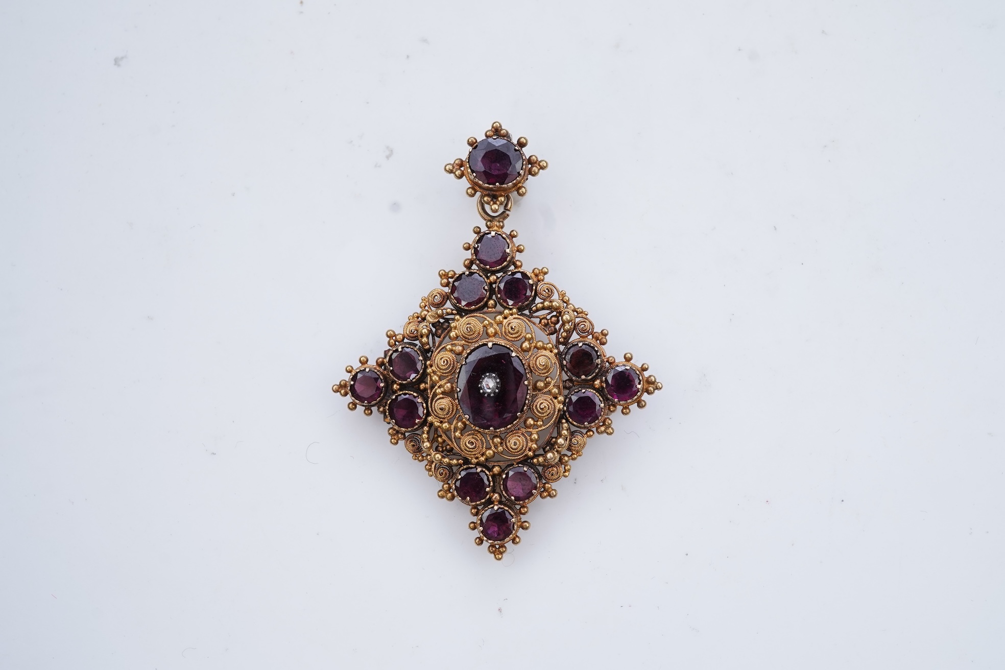 A late Georgian garnet pendant/brooch, 1830s